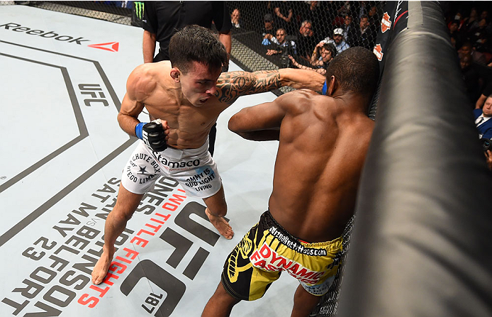 MONTREAL, QC - APRIL 25:   (L-R) Thomas Almeida of Brazil punches Yves Jabouin of Canada in their bantamweight bout during the UFC 186 event at the Bell Centre on April 25, 2015 in Montreal, Quebec, Canada. (Photo by Josh Hedges/Zuffa LLC/Zuffa LLC via Ge