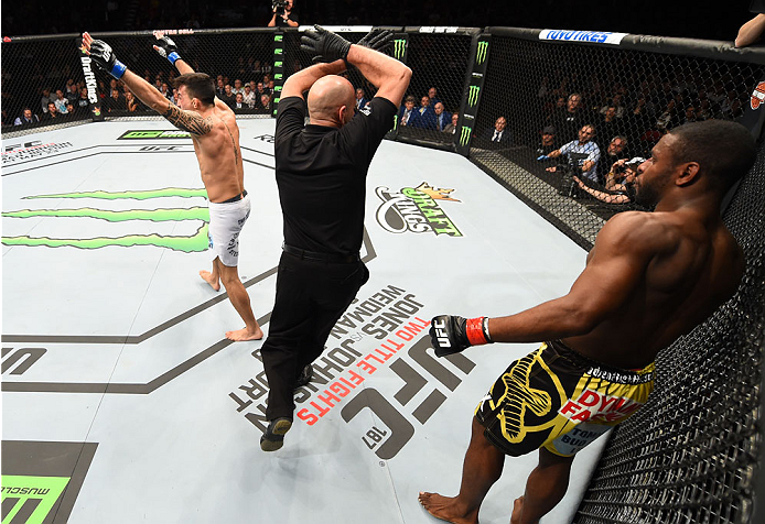 MONTREAL, QC - APRIL 25:   Thomas Almeida (L) of Brazil reacts after his TKO victory over Yves Jabouin of Canada in their bantamweight bout during the UFC 186 event at the Bell Centre on April 25, 2015 in Montreal, Quebec, Canada. (Photo by Josh Hedges/Zu