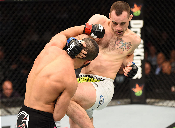 MONTREAL, QC - APRIL 25:   (R-L) Shane Campbell of the United States knees John Makdessi of Canada in their catchweight bout during the UFC 186 event at the Bell Centre on April 25, 2015 in Montreal, Quebec, Canada. (Photo by Josh Hedges/Zuffa LLC/Zuffa L