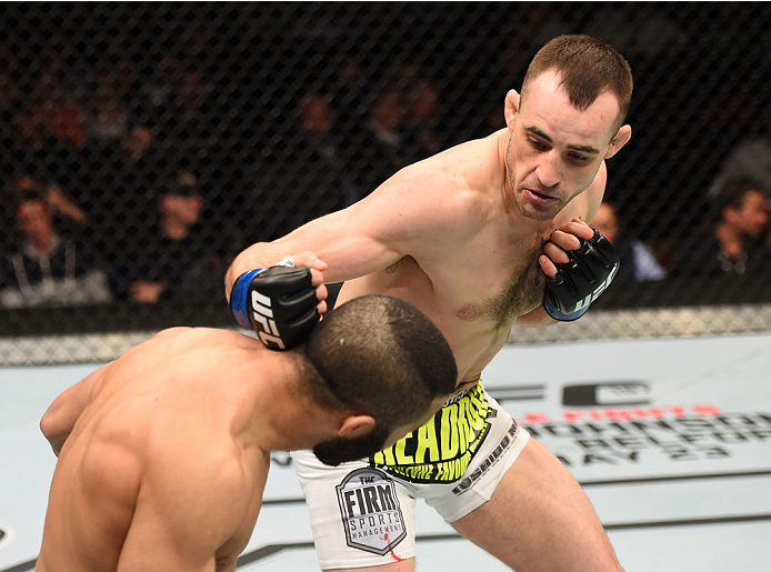 MONTREAL, QC - APRIL 25: (R-L) Shane Campbell of the United States punches John Makdessi of Canada in their catchweight bout during the UFC 186 event at the Bell Centre on April 25, 2015 in Montreal, Quebec, Canada. (Photo by Josh Hedges/Zuffa LLC/Zuffa