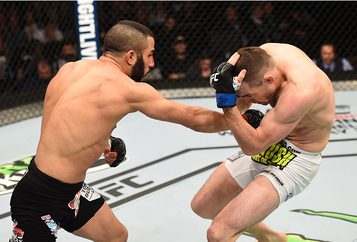 MONTREAL, QC - APRIL 25:   (L-R) John Makdessi of Canada punches Shane Campbell of the United States in their catchweight bout during the UFC 186 event at the Bell Centre on April 25, 2015 in Montreal, Quebec, Canada. (Photo by Josh Hedges/Zuffa LLC/Zuffa