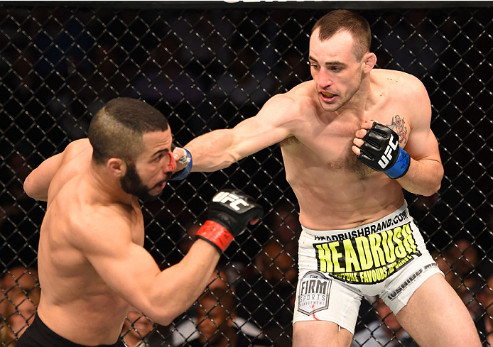 MONTREAL, QC - APRIL 25: (R-L) Shane Campbell of the United States punches John Makdessi of Canada in their catchweight bout during the UFC 186 event at the Bell Centre on April 25, 2015 in Montreal, Quebec, Canada. (Photo by Josh Hedges/Zuffa LLC/Zuffa
