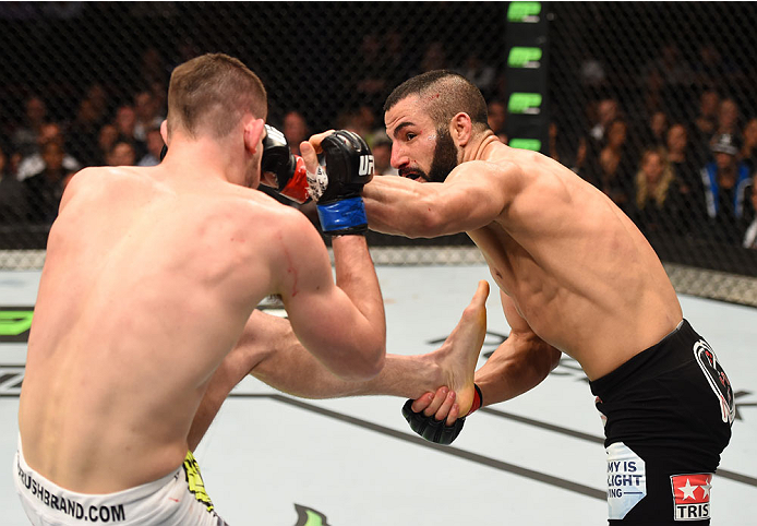 MONTREAL, QC - APRIL 25:   (R-L) John Makdessi of Canada punches Shane Campbell of the United States in their catchweight bout during the UFC 186 event at the Bell Centre on April 25, 2015 in Montreal, Quebec, Canada. (Photo by Josh Hedges/Zuffa LLC/Zuffa