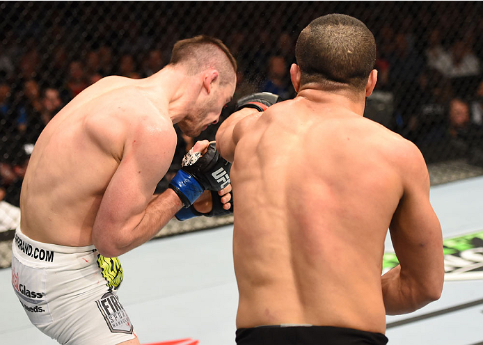 MONTREAL, QC - APRIL 25:   (R-L) John Makdessi of Canada punches Shane Campbell of the United States in their catchweight bout during the UFC 186 event at the Bell Centre on April 25, 2015 in Montreal, Quebec, Canada. (Photo by Josh Hedges/Zuffa LLC/Zuffa