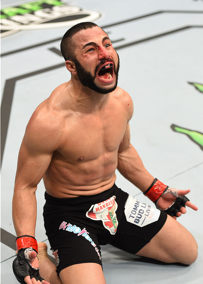 MONTREAL, QC - APRIL 25:   John Makdessi of Canada reacts after his TKO victory over Shane Campbell of the United States in their catchweight bout during the UFC 186 event at the Bell Centre on April 25, 2015 in Montreal, Quebec, Canada. (Photo by Josh He