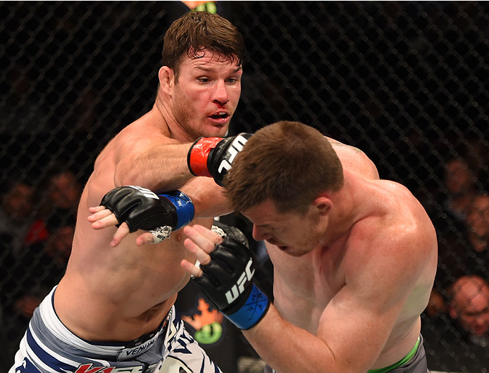 MONTREAL, QC - APRIL 25:   (L-R) Michael Bisping of England punches CB Dollaway of the United States in their middleweight bout during the UFC 186 event at the Bell Centre on April 25, 2015 in Montreal, Quebec, Canada. (Photo by Josh Hedges/Zuffa LLC/Zuff