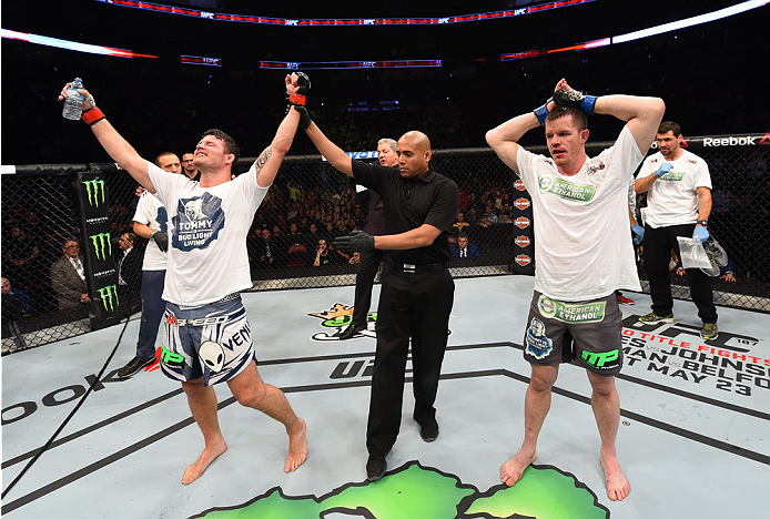 MONTREAL, QC - APRIL 25:   Michael Bisping (L) of England celebrates after his decision victory over CB Dollaway of the United States in their middleweight bout during the UFC 186 event at the Bell Centre on April 25, 2015 in Montreal, Quebec, Canada. (Ph