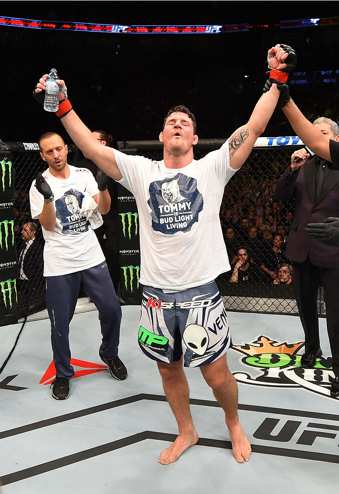 MONTREAL, QC - APRIL 25:   Michael Bisping of England celebrates after his decision victory over CB Dollaway of the United States in their middleweight bout during the UFC 186 event at the Bell Centre on April 25, 2015 in Montreal, Quebec, Canada. (Photo 