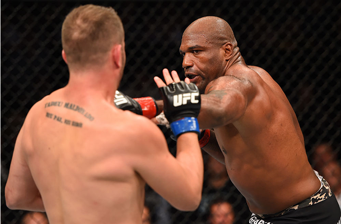 MONTREAL, QC - APRIL 25:   (R-L) Quinton 'Rampage' Jackson of the United States punches Fabio Maldonado of Brazil in their catchweight bout during the UFC 186 event at the Bell Centre on April 25, 2015 in Montreal, Quebec, Canada. (Photo by Josh Hedges/Zu