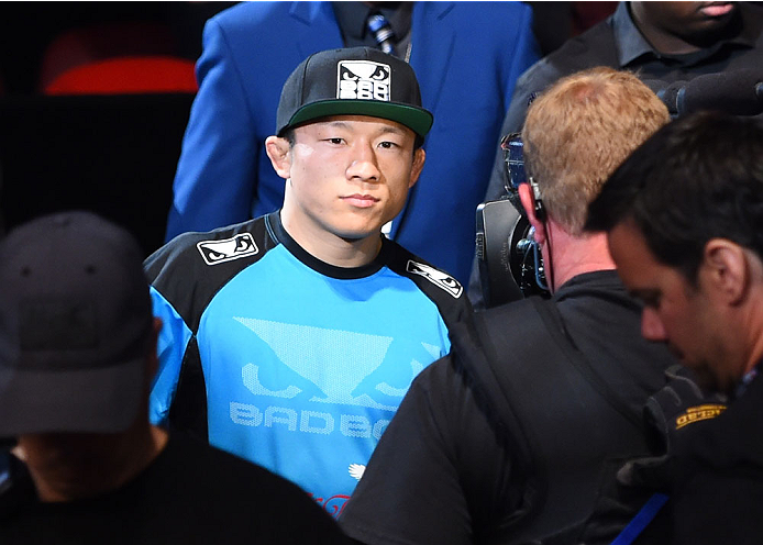 MONTREAL, QC - APRIL 25:   Kyoji Horiguchi of Japan prepares to enter the Octagon before his UFC flyweight championship bout against Demetrious Johnson of the United States during the UFC 186 event at the Bell Centre on April 25, 2015 in Montreal, Quebec,