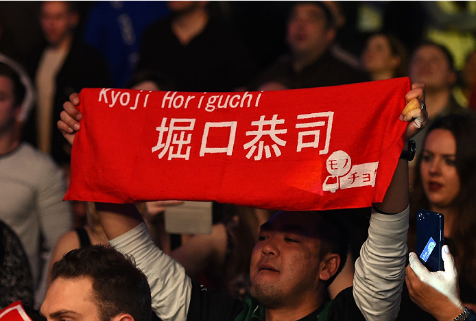 MONTREAL, QC - APRIL 25:   A fan holds a sign in support of Kyoji Horiguchi of Japan before his UFC flyweight championship bout against Demetrious Johnson during the UFC 186 event at the Bell Centre on April 25, 2015 in Montreal, Quebec, Canada. (Photo by