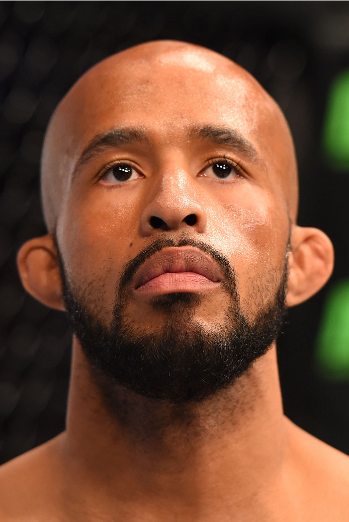 MONTREAL, QC - APRIL 25:   Demetrious Johnson of the United States stands in the Octagon before his UFC flyweight championship bout against Kyoji Horiguchi during the UFC 186 event at the Bell Centre on April 25, 2015 in Montreal, Quebec, Canada. (Photo b