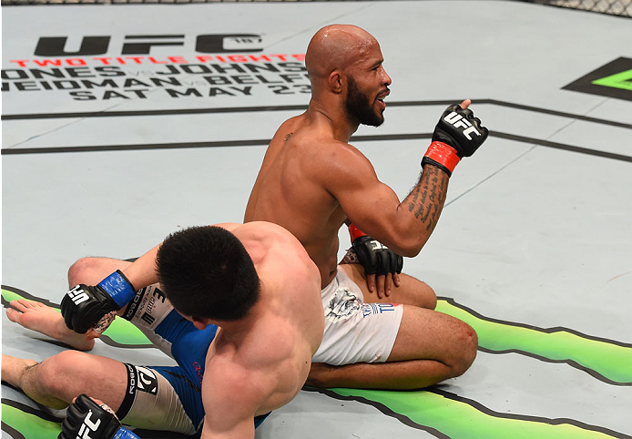 MONTREAL, QC - APRIL 25:   Demetrious Johnson of the United States reacts after his submission victory over Kyoji Horiguchi of Japan in their UFC flyweight championship bout during the UFC 186 event at the Bell Centre on April 25, 2015 in Montreal, Quebec