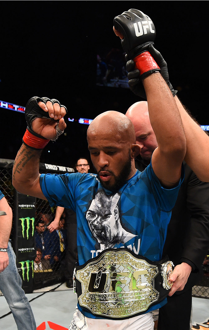 MONTREAL, QC - APRIL 25:   Demetrious Johnson of the United States reacts after his submission victory over Kyoji Horiguchi of Japan in their UFC flyweight championship bout during the UFC 186 event at the Bell Centre on April 25, 2015 in Montreal, Quebec