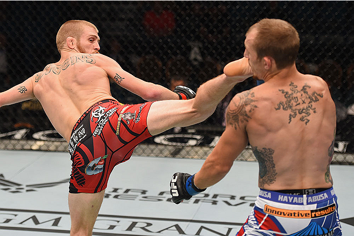 LAS VEGAS, NV - MAY 23:  (L-R) Justin Scoggins kicks Joshua Sampo in their flyweight bout during the UFC 187 event at the MGM Grand Garden Arena on May 23, 2015 in Las Vegas, Nevada.  (Photo by Josh Hedges/Zuffa LLC/Zuffa LLC via Getty Images)