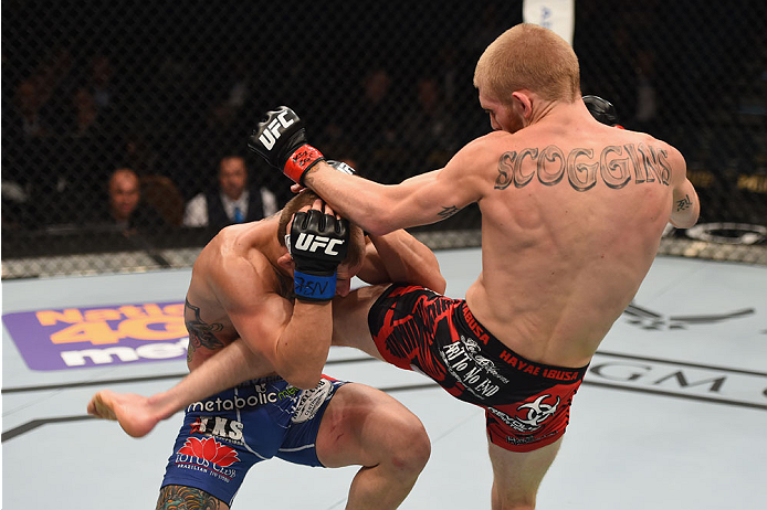 LAS VEGAS, NV - MAY 23:  (R-L) Justin Scoggins kicks Joshua Sampo in their flyweight bout during the UFC 187 event at the MGM Grand Garden Arena on May 23, 2015 in Las Vegas, Nevada.  (Photo by Josh Hedges/Zuffa LLC/Zuffa LLC via Getty Images)