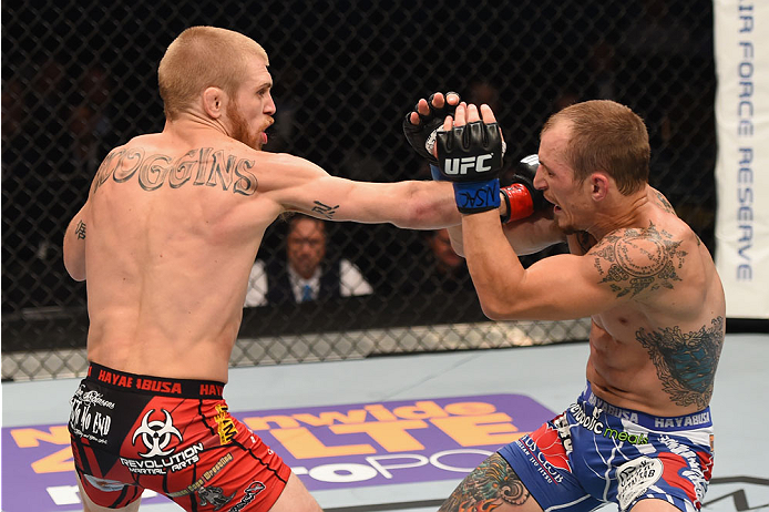 LAS VEGAS, NV - MAY 23: (L-R) Justin Scoggins punches Joshua Sampo in their flyweight bout during the UFC 187 event at the MGM Grand Garden Arena on May 23, 2015 in Las Vegas, Nevada. (Photo by Josh Hedges/Zuffa LLC/Zuffa LLC via Getty Images)