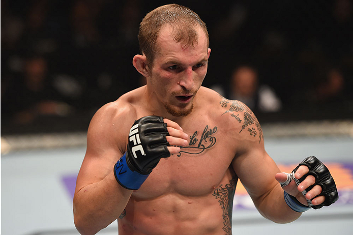LAS VEGAS, NV - MAY 23: Joshua Sampo stands across from Justin Scoggins in their flyweight bout during the UFC 187 event at the MGM Grand Garden Arena on May 23, 2015 in Las Vegas, Nevada. (Photo by Josh Hedges/Zuffa LLC/Zuffa LLC via Getty Images)
