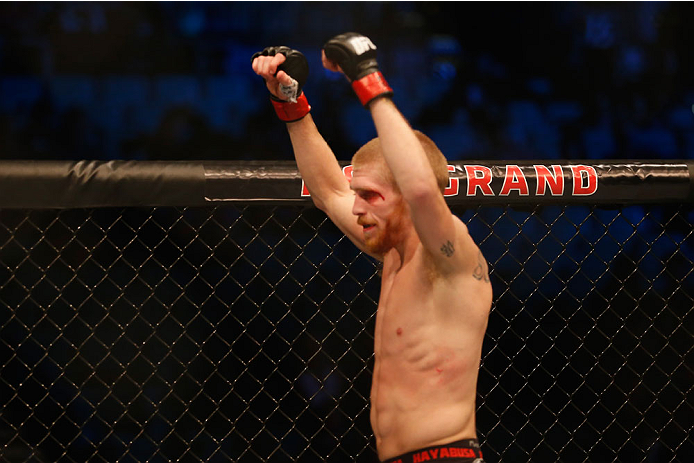 LAS VEGAS, NV - MAY 23:  Justin Scoggins celebrates his win over Joshua Sampo in their flyweight bout during the UFC 187 event at the MGM Grand Garden Arena on May 23, 2015 in Las Vegas, Nevada.  (Photo by Christian Petersen/Zuffa LLC/Zuffa LLC via Getty 