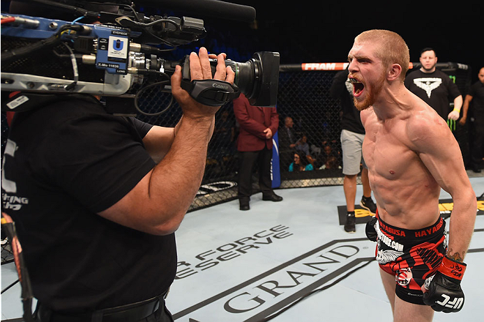 LAS VEGAS, NV - MAY 23:  Justin Scoggins (right) reacts to his victory over Joshua Sampo in their flyweight bout during the UFC 187 event at the MGM Grand Garden Arena on May 23, 2015 in Las Vegas, Nevada.  (Photo by Josh Hedges/Zuffa LLC/Zuffa LLC via Ge