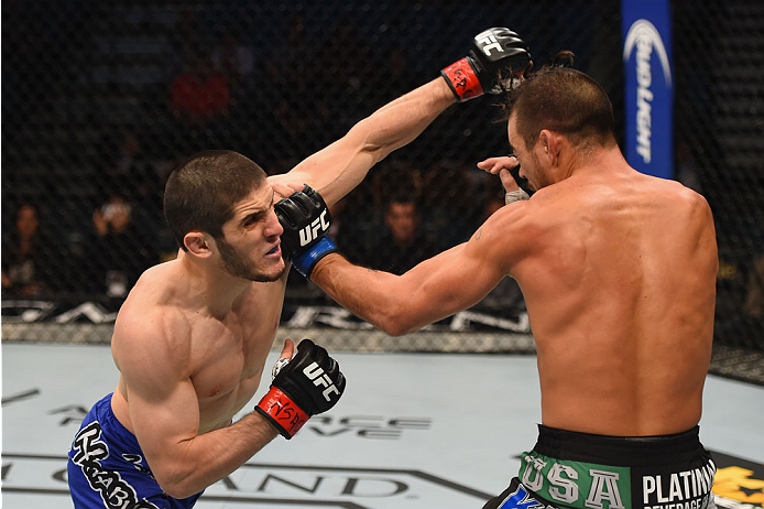 LAS VEGAS, NV - MAY 23:  (L-R) Islam Makhachev of Russia punches Leo Kuntz in their lightweight bout during the UFC 187 event at the MGM Grand Garden Arena on May 23, 2015 in Las Vegas, Nevada.  (Photo by Josh Hedges/Zuffa LLC/Zuffa LLC via Getty Images)