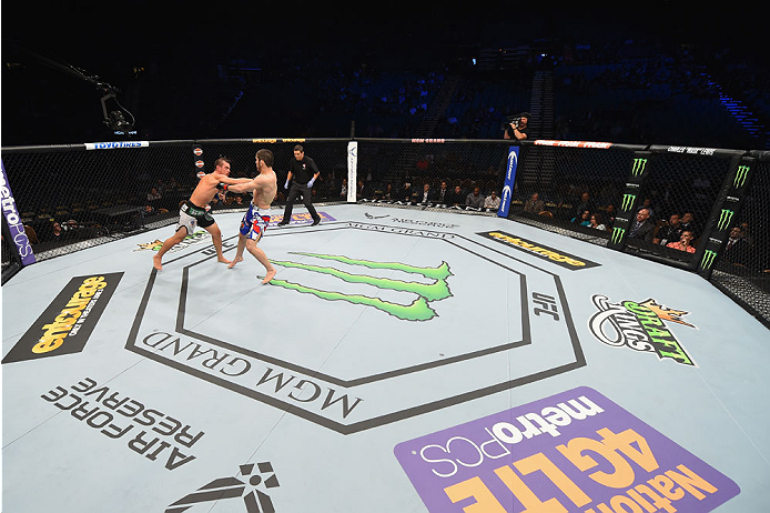 LAS VEGAS, NV - MAY 23:  (L-R) Leo Kuntz punches Islam Makhachev of Russia in their lightweight bout during the UFC 187 event at the MGM Grand Garden Arena on May 23, 2015 in Las Vegas, Nevada.  (Photo by Josh Hedges/Zuffa LLC/Zuffa LLC via Getty Images)