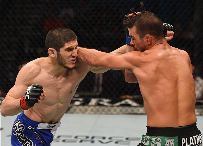 LAS VEGAS, NV - MAY 23: (L-R) Islam Makhachev of Russia punches Leo Kuntz in their lightweight bout during the UFC 187 event at the MGM Grand Garden Arena on May 23, 2015 in Las Vegas, Nevada. (Photo by Josh Hedges/Zuffa LLC/Zuffa LLC via Getty Images)