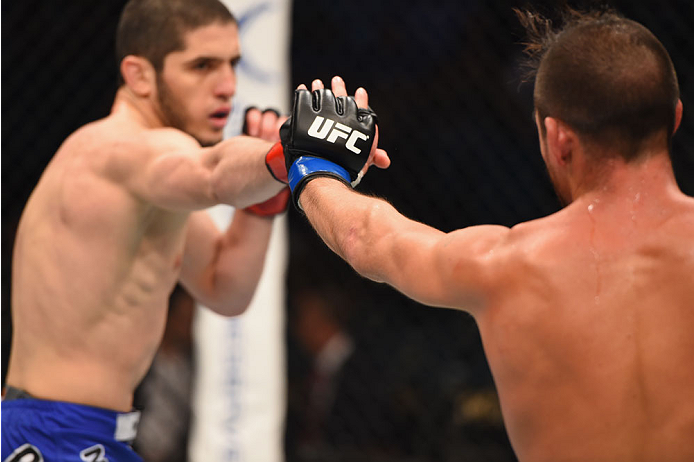 LAS VEGAS, NV - MAY 23:  (L-R) Islam Makhachev of Russia and Leo Kuntz touch gloves before round two of their lightweight bout during the UFC 187 event at the MGM Grand Garden Arena on May 23, 2015 in Las Vegas, Nevada.  (Photo by Josh Hedges/Zuffa LLC/Zu