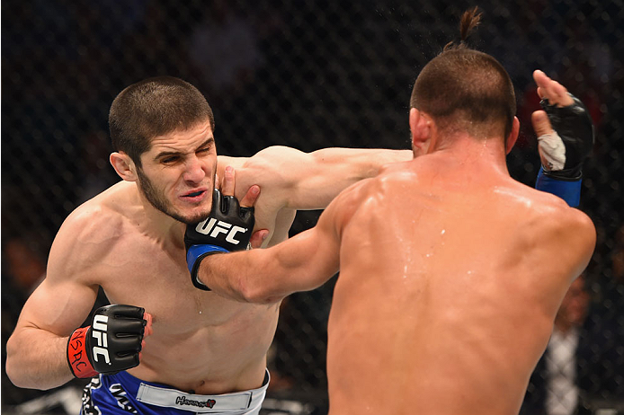 LAS VEGAS, NV - MAY 23: (L-R) Islam Makhachev of Russia punches Leo Kuntz in their lightweight bout during the UFC 187 event at the MGM Grand Garden Arena on May 23, 2015 in Las Vegas, Nevada. (Photo by Josh Hedges/Zuffa LLC/Zuffa LLC via Getty Images)