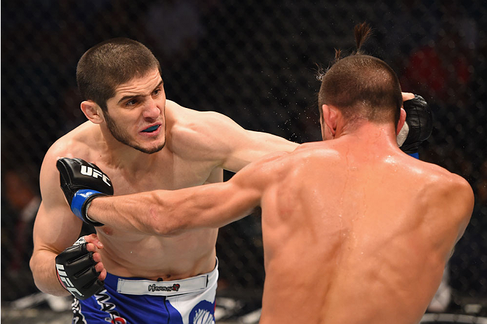 LAS VEGAS, NV - MAY 23: (L-R) Islam Makhachev of Russia punches Leo Kuntz in their lightweight bout during the UFC 187 event at the MGM Grand Garden Arena on May 23, 2015 in Las Vegas, Nevada. (Photo by Josh Hedges/Zuffa LLC/Zuffa LLC via Getty Images)