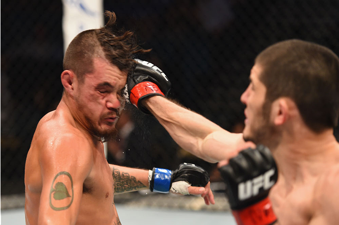 LAS VEGAS, NV - MAY 23: (R-L) Islam Makhachev of Russia punches Leo Kuntz in their lightweight bout during the UFC 187 event at the MGM Grand Garden Arena on May 23, 2015 in Las Vegas, Nevada. (Photo by Josh Hedges/Zuffa LLC/Zuffa LLC via Getty Images)