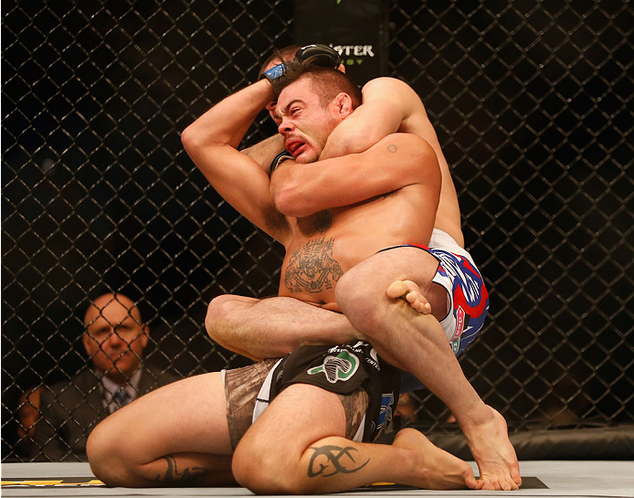 LAS VEGAS, NV - MAY 23: Islam Makhachev of Russia (top) attempts to submit Leo Kuntz in their lightweight bout during the UFC 187 event at the MGM Grand Garden Arena on May 23, 2015 in Las Vegas, Nevada. (Photo by Christian Petersen/Zuffa LLC/Zuffa LLC