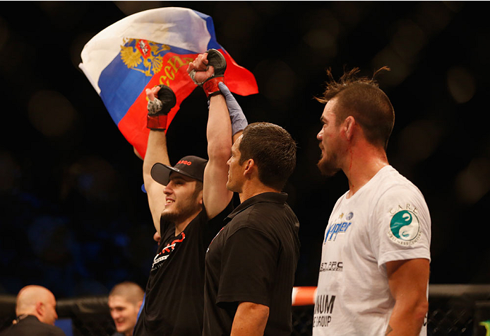 LAS VEGAS, NV - MAY 23:  Islam Makhachev of Russia (left) reacts to his victory over Leo Kuntz (right) in their lightweight bout during the UFC 187 event at the MGM Grand Garden Arena on May 23, 2015 in Las Vegas, Nevada.  (Photo by Christian Petersen/Zuf