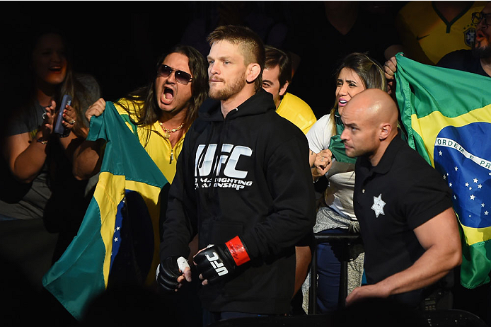 LAS VEGAS, NV - MAY 23: Mike Pyle (center) walks to the Octagon to face Colby Covington in their welterweight bout during the UFC 187 event at the MGM Grand Garden Arena on May 23, 2015 in Las Vegas, Nevada. (Photo by Josh Hedges/Zuffa LLC/Zuffa LLC via
