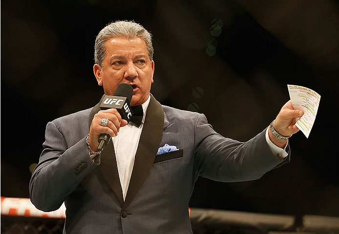 LAS VEGAS, NV - MAY 23:  Bruce Buffer introduces Mike Pyle and Colby Covington before their welterweight bout during the UFC 187 event at the MGM Grand Garden Arena on May 23, 2015 in Las Vegas, Nevada.  (Photo by Christian Petersen/Zuffa LLC/Zuffa LLC vi