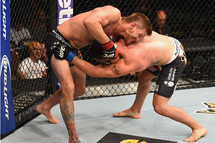 LAS VEGAS, NV - MAY 23:  (L-R) Mike Pyle wrestles with Colby Covington in their welterweight bout during the UFC 187 event at the MGM Grand Garden Arena on May 23, 2015 in Las Vegas, Nevada.  (Photo by Josh Hedges/Zuffa LLC/Zuffa LLC via Getty Images)