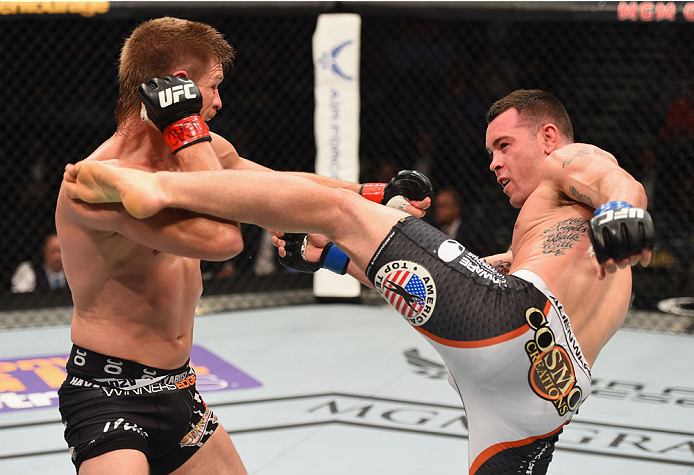 LAS VEGAS, NV - MAY 23: (R-L) Colby Covington kicks Mike Pyle in their welterweight bout during the UFC 187 event at the MGM Grand Garden Arena on May 23, 2015 in Las Vegas, Nevada. (Photo by Josh Hedges/Zuffa LLC/Zuffa LLC via Getty Images)