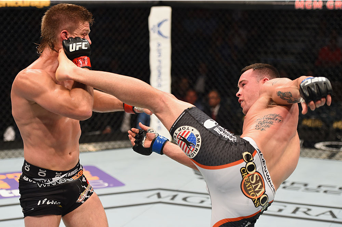 LAS VEGAS, NV - MAY 23: (R-L) Colby Covington kicks Mike Pyle in their welterweight bout during the UFC 187 event at the MGM Grand Garden Arena on May 23, 2015 in Las Vegas, Nevada. (Photo by Josh Hedges/Zuffa LLC/Zuffa LLC via Getty Images)