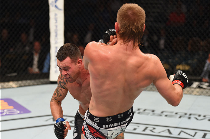 LAS VEGAS, NV - MAY 23:  (L-R) Colby Covington punches Mike Pyle in their welterweight bout during the UFC 187 event at the MGM Grand Garden Arena on May 23, 2015 in Las Vegas, Nevada.  (Photo by Josh Hedges/Zuffa LLC/Zuffa LLC via Getty Images)