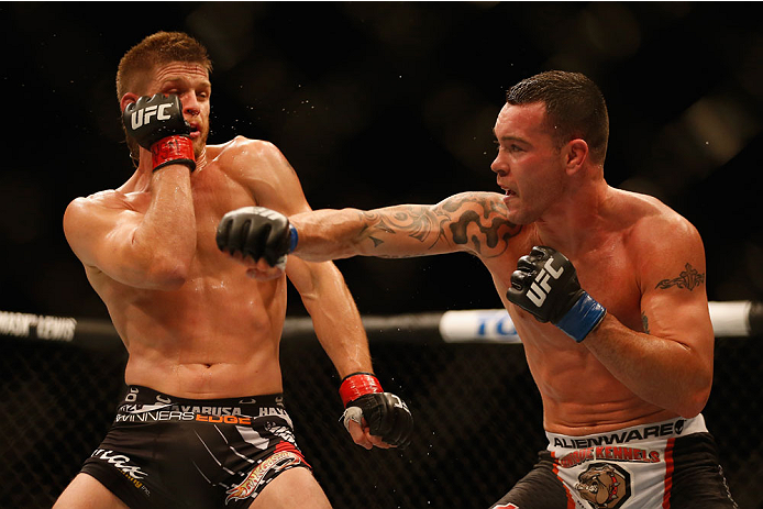 LAS VEGAS, NV - MAY 23:  (R-L) Colby Covington punches Mike Pyle in their welterweight bout during the UFC 187 event at the MGM Grand Garden Arena on May 23, 2015 in Las Vegas, Nevada.  (Photo by Christian Petersen/Zuffa LLC/Zuffa LLC via Getty Images)