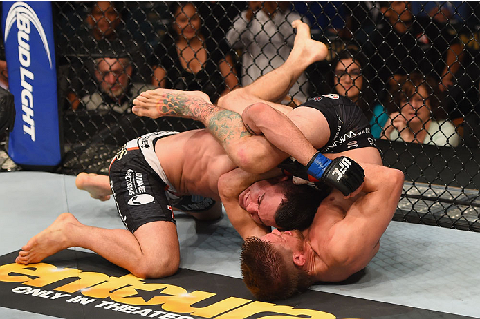 LAS VEGAS, NV - MAY 23: Mike Pyle (bottom) attempts to submit Colby Covington in their welterweight bout during the UFC 187 event at the MGM Grand Garden Arena on May 23, 2015 in Las Vegas, Nevada. (Photo by Josh Hedges/Zuffa LLC/Zuffa LLC via Getty Ima