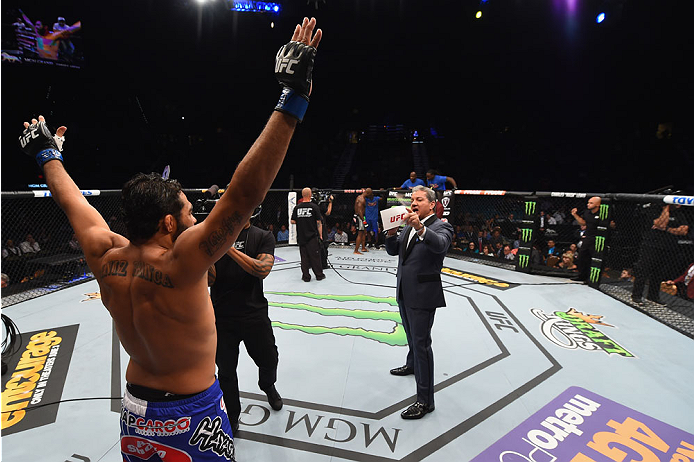 LAS VEGAS, NV - MAY 23: Bruce Buffer (right) introduces Rafael Natal of Brazil (left) before their middleweight bout during the UFC 187 event at the MGM Grand Garden Arena on May 23, 2015 in Las Vegas, Nevada. (Photo by Josh Hedges/Zuffa LLC/Zuffa LLC v