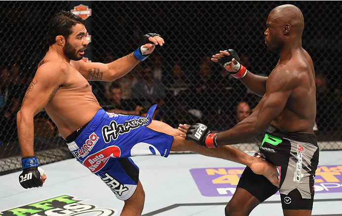 LAS VEGAS, NV - MAY 23:  (L-R) Rafael Natal of Brazil kicks Uriah Hall in their middleweight bout during the UFC 187 event at the MGM Grand Garden Arena on May 23, 2015 in Las Vegas, Nevada.  (Photo by Josh Hedges/Zuffa LLC/Zuffa LLC via Getty Images)