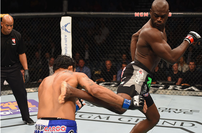 LAS VEGAS, NV - MAY 23: (R-L) Uriah Hall kicks Rafael Natal of Brazil in their middleweight bout during the UFC 187 event at the MGM Grand Garden Arena on May 23, 2015 in Las Vegas, Nevada. (Photo by Josh Hedges/Zuffa LLC/Zuffa LLC via Getty Images)