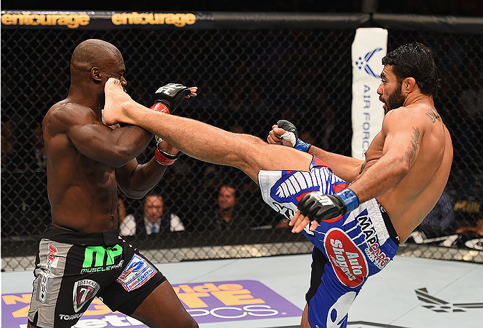LAS VEGAS, NV - MAY 23: (R-L) Rafael Natal of Brazil kicks Uriah Hall in their middleweight bout during the UFC 187 event at the MGM Grand Garden Arena on May 23, 2015 in Las Vegas, Nevada. (Photo by Josh Hedges/Zuffa LLC/Zuffa LLC via Getty Images)