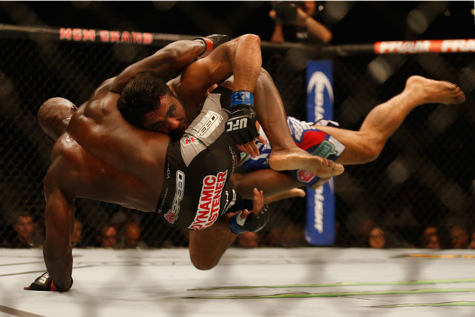 LAS VEGAS, NV - MAY 23:  (R-L) Rafael Natal of Brazil takes down Uriah Hall in their middleweight bout during the UFC 187 event at the MGM Grand Garden Arena on May 23, 2015 in Las Vegas, Nevada.  (Photo by Christian Petersen/Zuffa LLC/Zuffa LLC via Getty