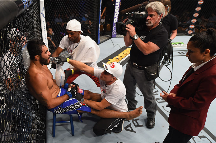 LAS VEGAS, NV - MAY 23:  Rafael Natal of Brazil (left) prepares for round three of his middleweight bout during the UFC 187 event at the MGM Grand Garden Arena on May 23, 2015 in Las Vegas, Nevada.  (Photo by Josh Hedges/Zuffa LLC/Zuffa LLC via Getty Imag