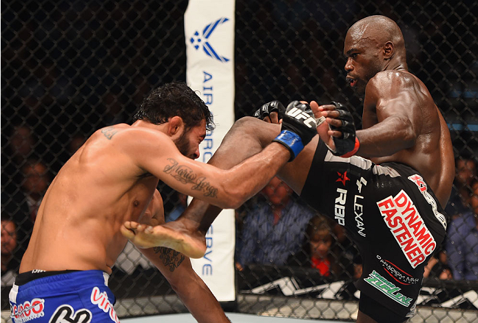 LAS VEGAS, NV - MAY 23: (R-L) Uriah Hall kicks Rafael Natal of Brazil in their middleweight bout during the UFC 187 event at the MGM Grand Garden Arena on May 23, 2015 in Las Vegas, Nevada. (Photo by Josh Hedges/Zuffa LLC/Zuffa LLC via Getty Images)