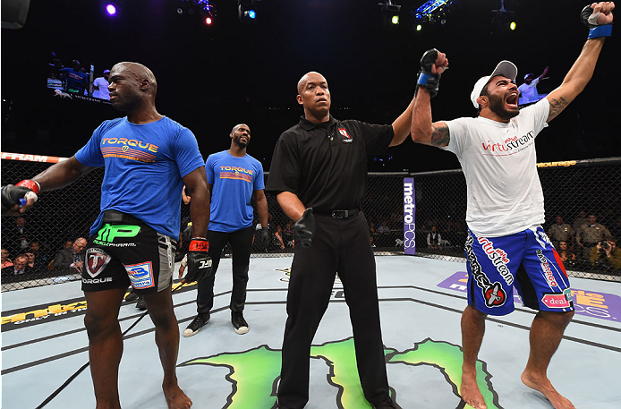 LAS VEGAS, NV - MAY 23:  Rafael Natal of Brazil (right) reacts to his victory over Uriah Hall (left) in their middleweight bout during the UFC 187 event at the MGM Grand Garden Arena on May 23, 2015 in Las Vegas, Nevada.  (Photo by Josh Hedges/Zuffa LLC/Z