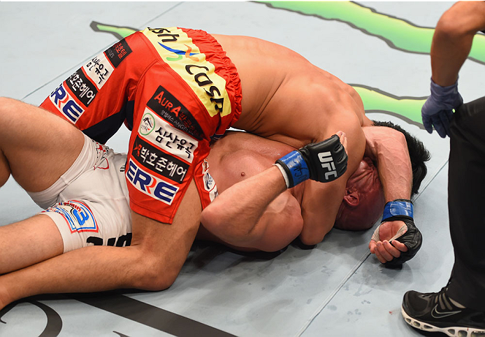 LAS VEGAS, NV - MAY 23: Dong Hyun Kim (top) attempts to submit Josh Burkman in their welterweight bout during the UFC 187 event at the MGM Grand Garden Arena on May 23, 2015 in Las Vegas, Nevada. (Photo by Josh Hedges/Zuffa LLC/Zuffa LLC via Getty Image
